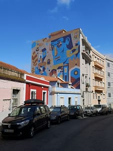 Colourful work in Graça by Aka Corleone, street art artist in Lisbon