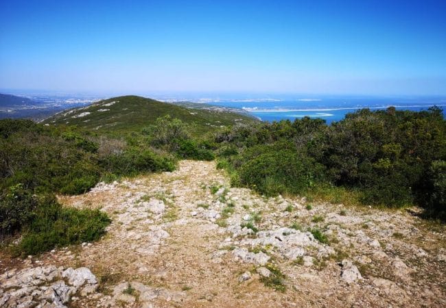 Hiking in Lisbon on the Serra da Arrabida at the top of the summit with view on the ocean