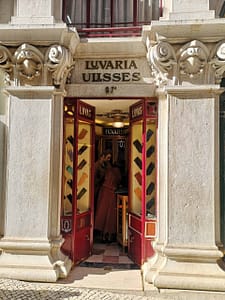 Historic Ulisses shop in Lisbon's Chiado district, offering elegant leather gloves made in Portugal